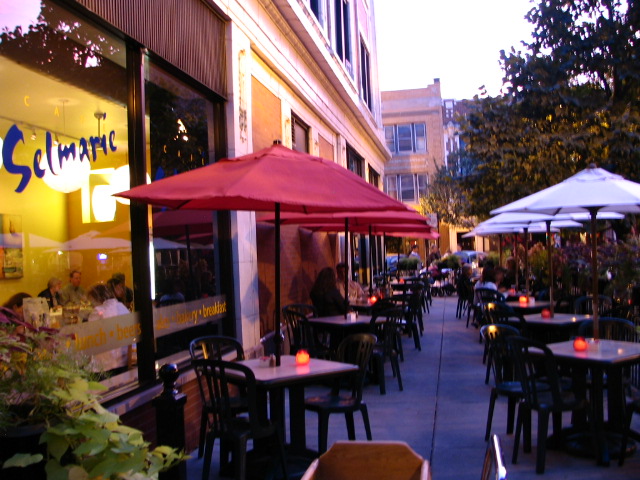 Customers dine on Cafe Selmarie's outdoor patio at dusk