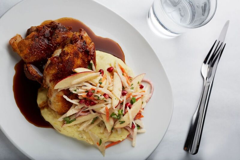 Roasted Amish half chicken with mashed potatoes and apple-pomegranate slaw.