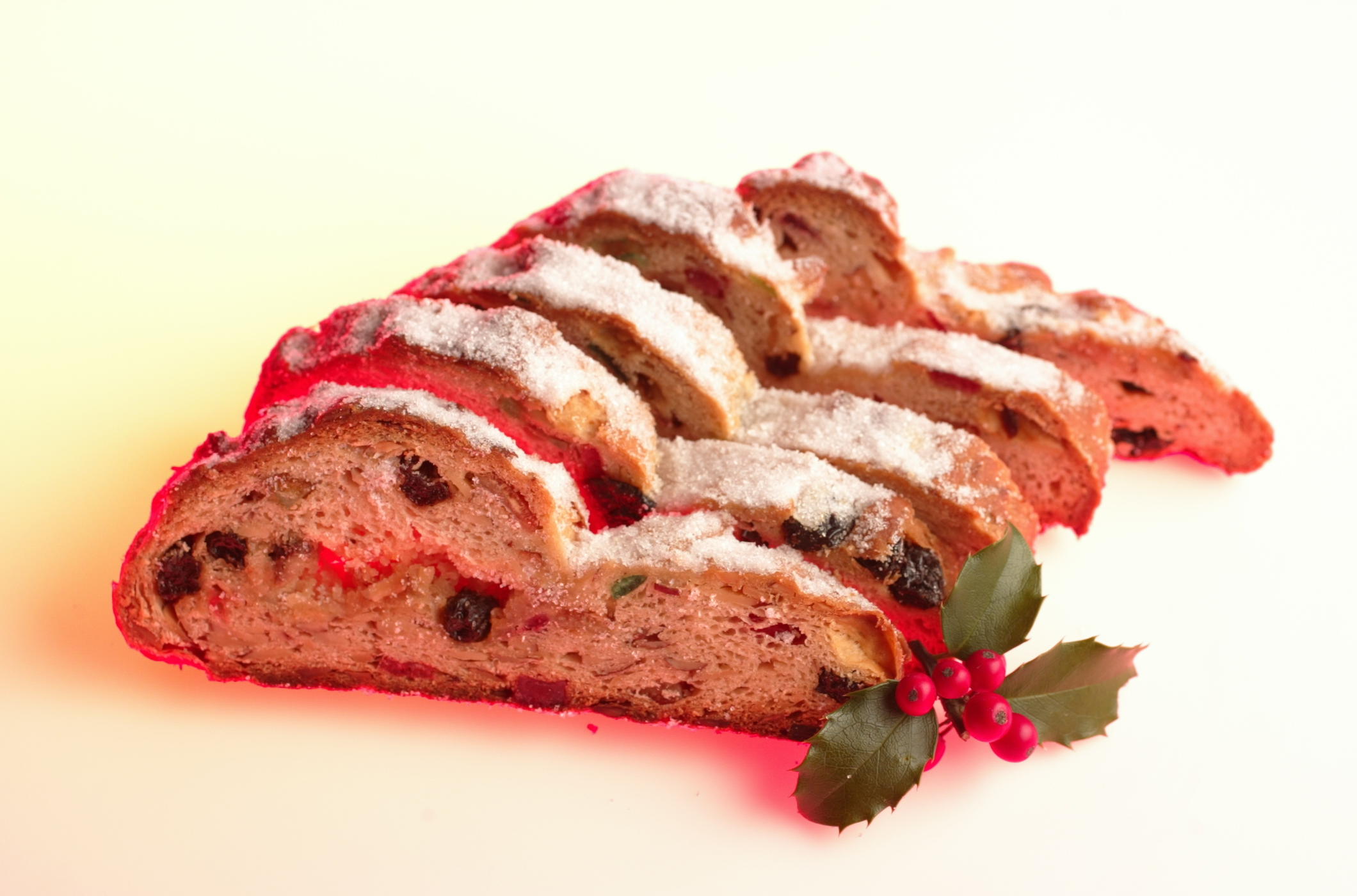 Slices of stollen with a sprig of holly.