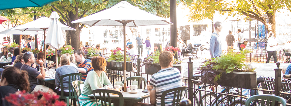 Customers have brunch on Cafe Selmarie's outdoor patio overlooking Giddings Plaza.