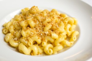 Close-up of macaroni and cheese in a white bowl.