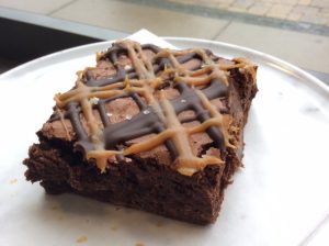 Salted caramel brownie on a white plate
