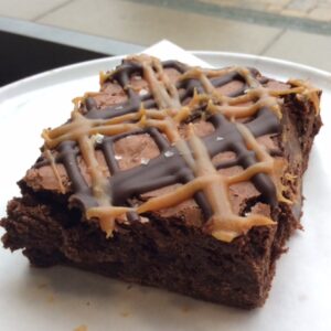 Salted caramel brownie on a white plate
